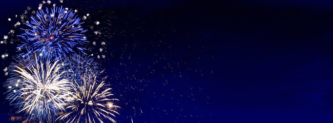 Wall Mural - fireworks, colorful sylvester-fireworks on blue background with sparks and space for text