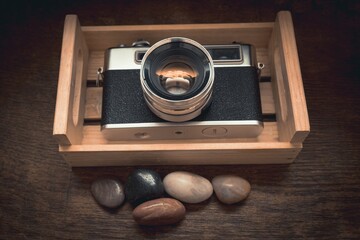 High angle closeup shot of a vintage camera in a locker under the light