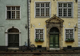 Fototapeta Do pokoju - old town architecture with bicycle leaning against house wall   