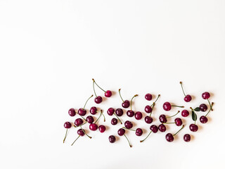 Wall Mural - Frame of large ripe cherry berries on white background. Natural summer food background. Creative food summer layout. top view. Copy space