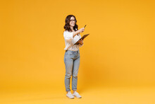 Smiling Young Business Woman In White Shirt Glasses Isolated On Yellow Background. Achievement Career Wealth Business Concept. Mock Up Copy Space. Hold Clipboard With Papers Document, Point Pen Aside.