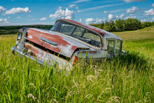Abandoned Antique Blue Sedan In The Tall Grass On A Hillside Near Wymark, SK