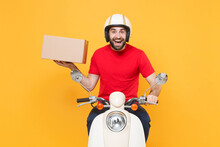 Delivery Man Helmet Red Tshirt Uniform Driving Moped Motorbike Scooter Hold Cardboard Box Isolated On Yellow Background Studio Guy Employee Working Courier Service Quarantine Pandemic Covid-19 Concept