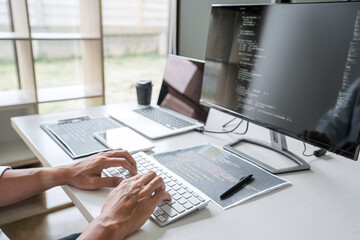 Young programmer working at developing programming and website in software