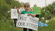 © Andrii Iemelianenko - Girl volunteer holds protesting poster Don't Trash Our Future. Plastic nature pollution. Recycle