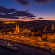 Aerial drone shot of Matthias Churh, St. Anne Church and market hall by Danube in Budapest sunset