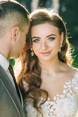 Wall Mural - Villa Balbianello wedding photoshoot beautiful couple bride and groom long veil and white dress on mountains background lake Como Italy ceremony luxury beautiful sunny day