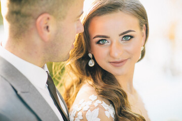 Wall Mural - Villa Balbianello wedding photoshoot beautiful couple bride and groom long veil and white dress on mountains background lake Como Italy ceremony luxury beautiful sunny day