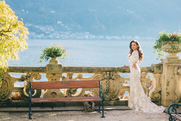 Wall Mural - Wedding Bride with veil and white wedding dress on villa Balbianello lake Como in Italy