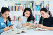 © Creativa Images - Group of lazy teenage girls studying in the library