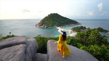 Wall Mural - Woman walking on viewpoint at Nang Yuan island, Thailand.