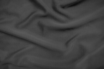 Background texture black cloth. Abstract dark wavy soft. Fabric is wrinkled. Fashion luxury style.