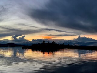 Wall Mural - Silver sunset over the lake Titicaca in Peru, Uros Floating Islands. 