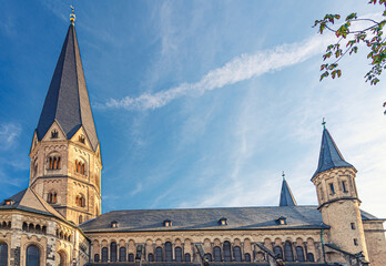 Bonn Minster or Bonner Munster Roman Catholic church Romanesque architecture building in historical city centre, blue sky background, North Rhine-Westphalia region, Germany