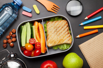 Wall Mural - School lunch box and education stationery on stone table