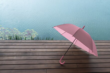 Pink Umbrella On Wood Terrace Nearby Summer Lake Nature Whether Background