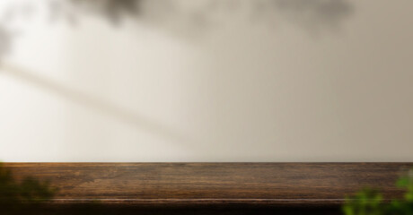 Aufkleber - dark brown wood table background with leaf shadow on wall and plant at home