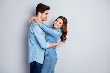 Wall Mural - Profile photo lady guy couple in love cuddle hugging together holding hands romantic feelings slow dance wear casual denim shirts outfit isolated grey color background