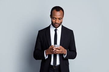 portrait of focused smart confident afro american collar chief man use smartphone read business soci