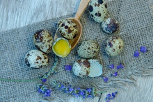 
Quail Eggs On A Cloth And A Wooden Spoon