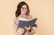 © Drobot Dean - Image of smiling caucasian woman in eyeglasses reading book