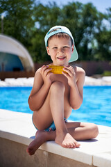 boy on the beach eating corn on the beach