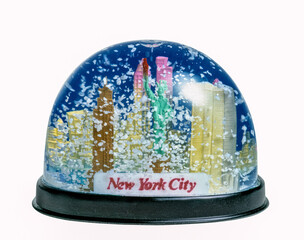 Wall Mural - snow globe of New York City with falling snow on white background