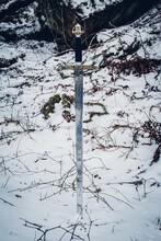 Vertical Shot Of A Sword In The Snowy Ground