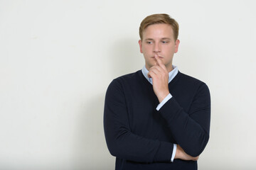 Wall Mural - Portrait of man with blond hair thinking and looking down