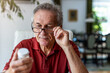 © pikselstock - Senior man taking prescription medicine at home