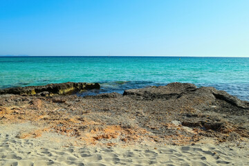 Bright blue sea shore without people in sunny day