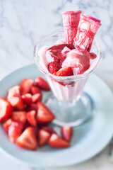 Wall Mural - Strawberry ice cream with fresh ripe strawberries in a glass bowl