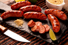 Grilled Sausage. Grilled Sausage On Wooden Board. Brazilian Barbecue.