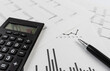 © Christian Horz - bookkeeping and accounting business concept, calculator and pen on data sheets and printed charts