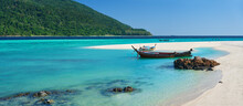 Boat On Tropical White Sandy Beach And Turquoise Water Panorama