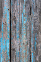 Close-up Of Weathered And Worn Wooden Panel With Blue Flaking Paint