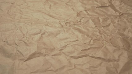 Wall Mural - Crumpled shabby wrapping brown paper close-up. Abstract textured background