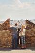 © bakharev - young couple in love walking on a street of European city. sightseeing traveler. Prague, Czech Republic.