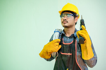 Poster - Electrician,Smiling electrician in helmet and safety with cabling and tools on white background.