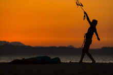 Kite Girl Posing In Front Of An Incredible Sunset