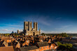 West Front of Lincoln Cathedral over rooftops with lots of sky room, Lincoln, Lincolnshire, United Kingdom - September 2016