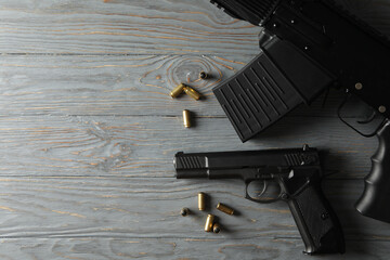 Wall Mural - Weapon on gray wooden background, top view