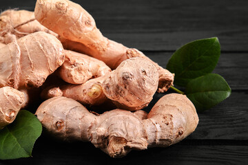 Fresh ginger root on stone background. Vitamins. Top view. Free space for your text.