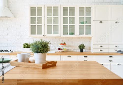 Cuadros en Lienzo Kitchen wooden table top and kitchen blur background interior style scandinavian
