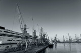 Fototapeta Londyn - Harbor cranes, black and white poster