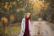 © Maria - Portrait of a happy cute red-haired child girl with freckles in a colorful autumn forest or park. Autumn mood.