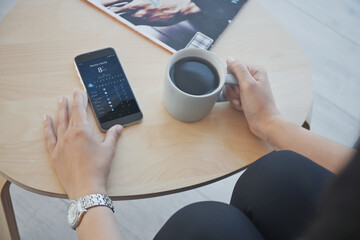 Wall Mural - woman with cup of coffee using weather forecast app on smartphone indoors, closeup