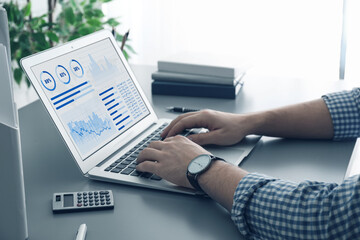 man working on laptop at table, closeup. fintech concept