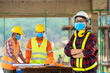 © visoot - Team engineers and architect having wearing protective masks to prevent dust and covid 19 disease during the inspection in construction site.