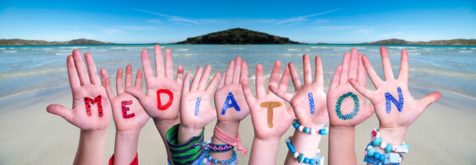 Wall Mural - Children Hands Building Colorful English Word Mediation. Ocean And Beach As Background